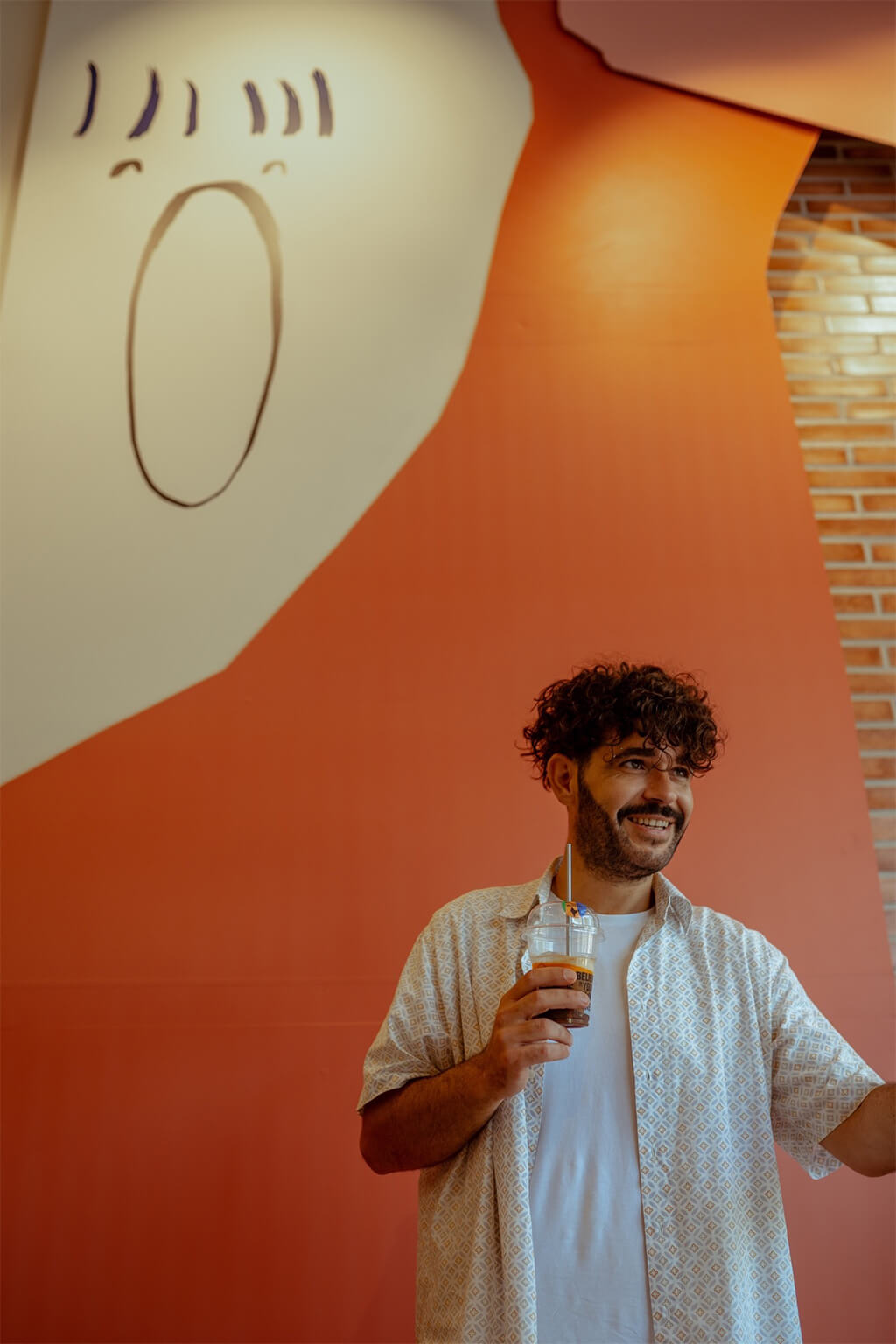 man holding a coffee cup